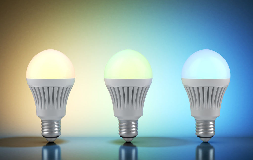 Three smart lightbulbs with yellow, green and blue colors